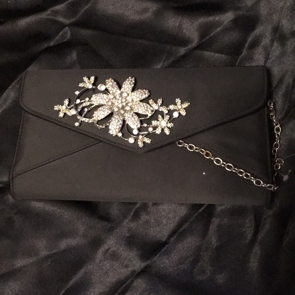 Fashion handbag. New! Blk with white rhinestone flower.  It has a chain.